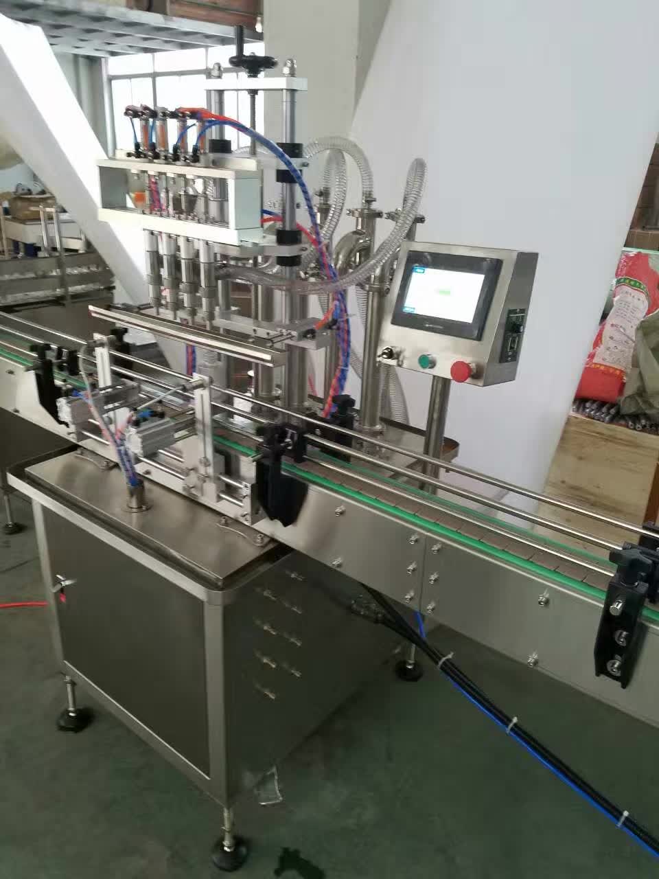 4 heads automatic liquid filling machine